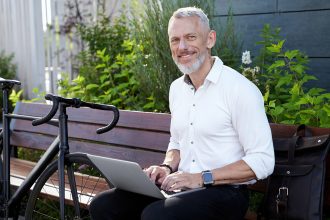 building-business-successful-modern-middle-aged-businessman-stylish-suit-smiling-camera