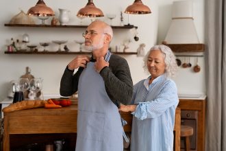 senior-couple-cooking-together-kitchen